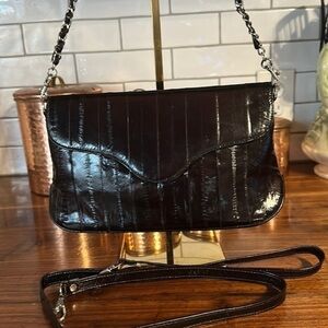 Vintage eel skin bag. No call outs. Has two straps.